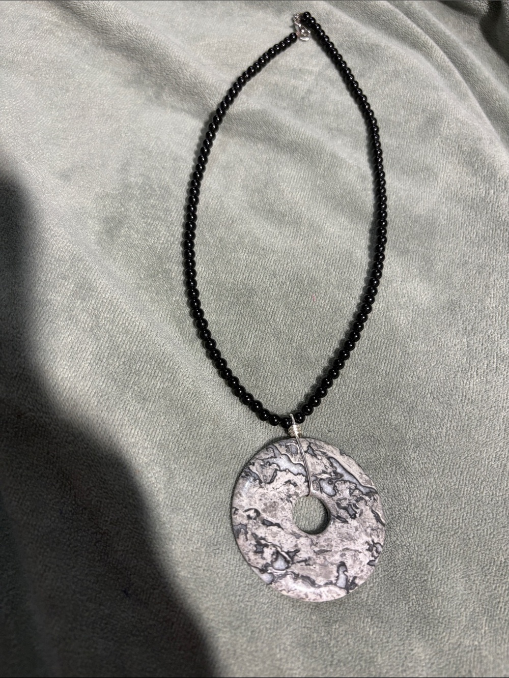 Handcrafted Black Bead Necklace with pinolite gemstone pi disc